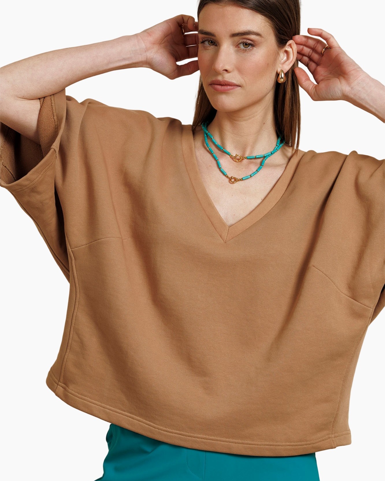turquoise necklace, turndown neck, beige top, v-neck blouse, sleeveless poncho
